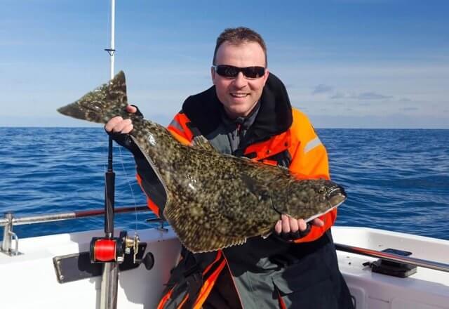 Catching halibut on vancouver island fishing trip